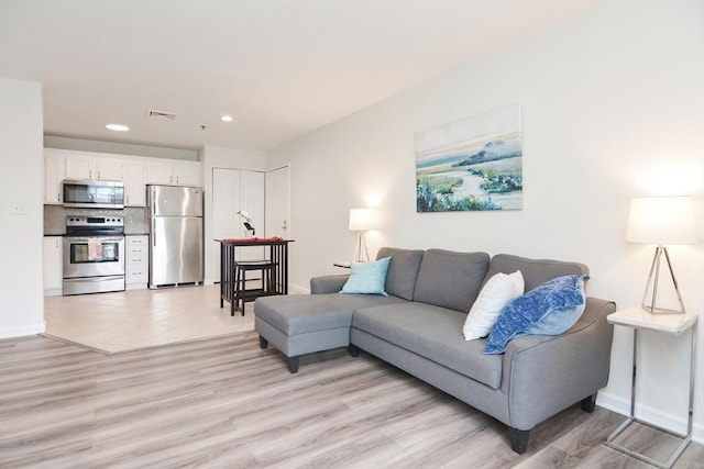 living room with light hardwood / wood-style floors