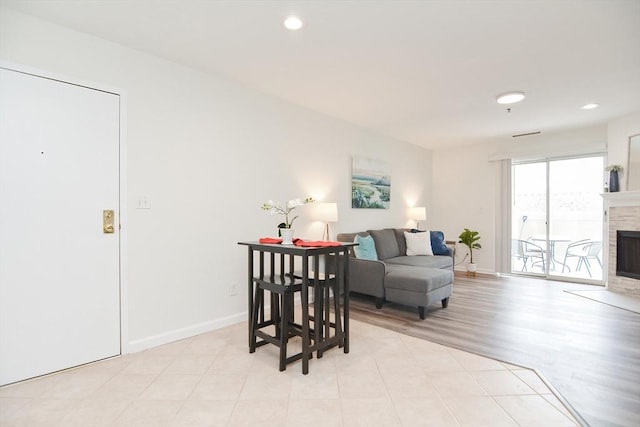 living room with light hardwood / wood-style flooring