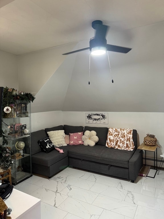 living room with lofted ceiling, ceiling fan, and a baseboard heating unit