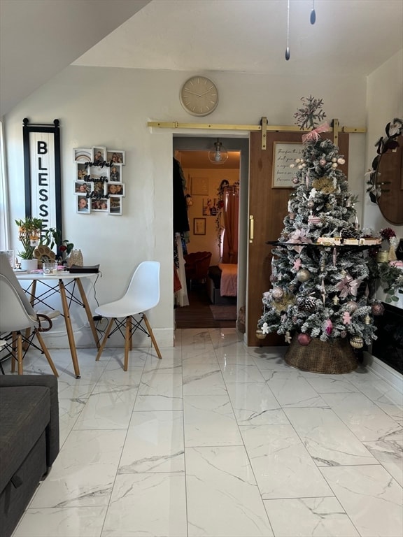 interior space featuring a barn door