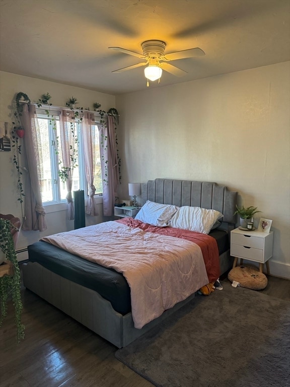 bedroom with dark wood-type flooring and ceiling fan