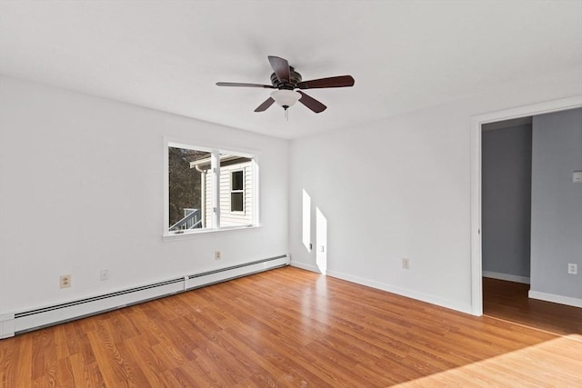 unfurnished room with light wood-type flooring, ceiling fan, and a baseboard heating unit