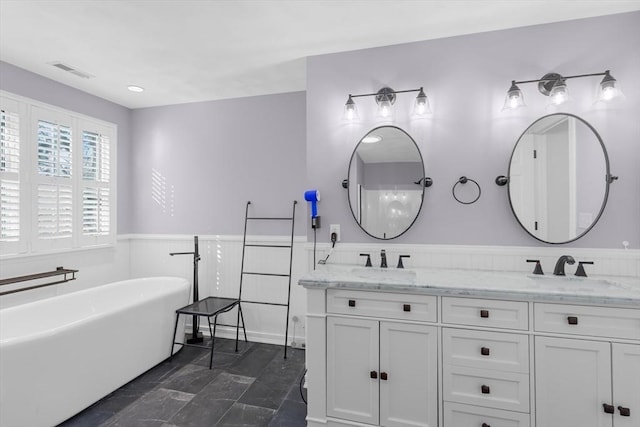 bathroom featuring a bathtub and vanity