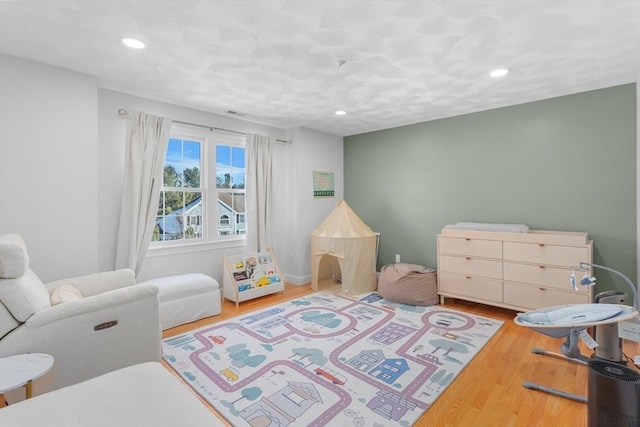 bedroom featuring hardwood / wood-style flooring