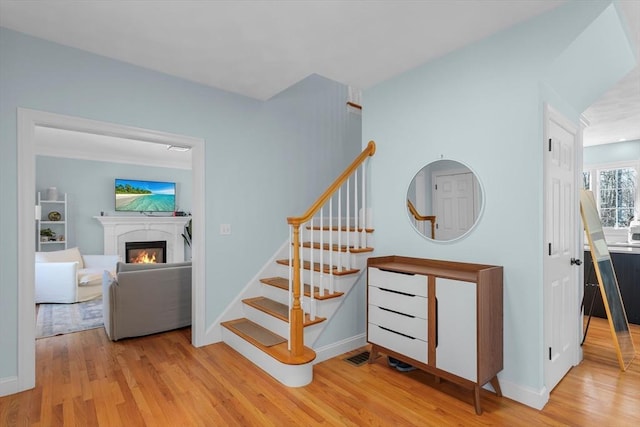 stairway featuring hardwood / wood-style floors