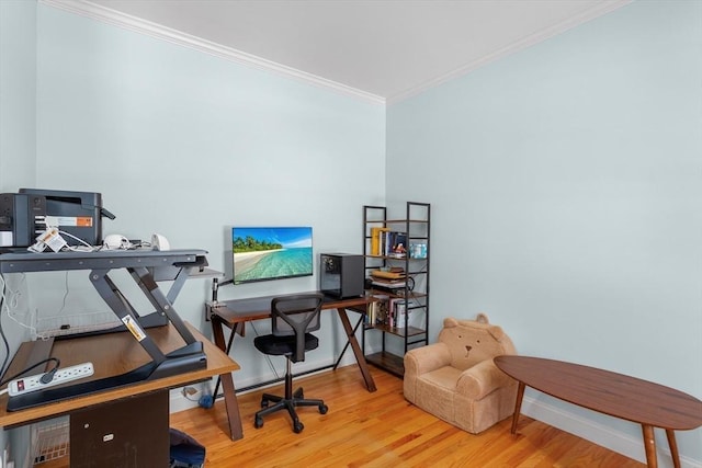 home office featuring hardwood / wood-style floors and ornamental molding