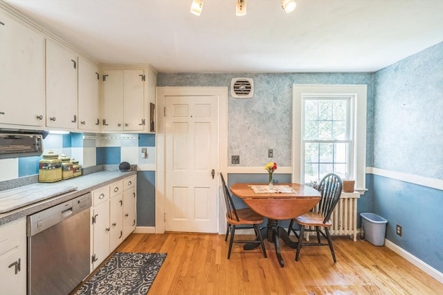 22 Sycamore Rd, Weymouth, MA 02190 - kitchen with stainless steel dishwasher, light wood finished floors, light countertops, white cabinets, and baseboards