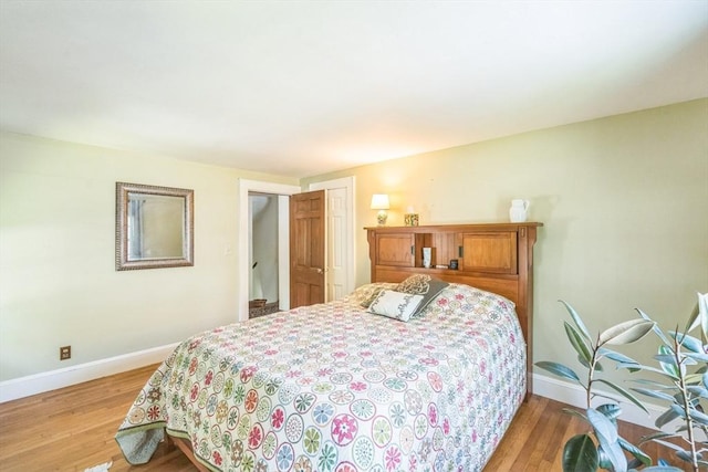 22 Sycamore Rd, Weymouth, MA 02190 - bedroom with baseboards, light wood-style flooring, and a closet