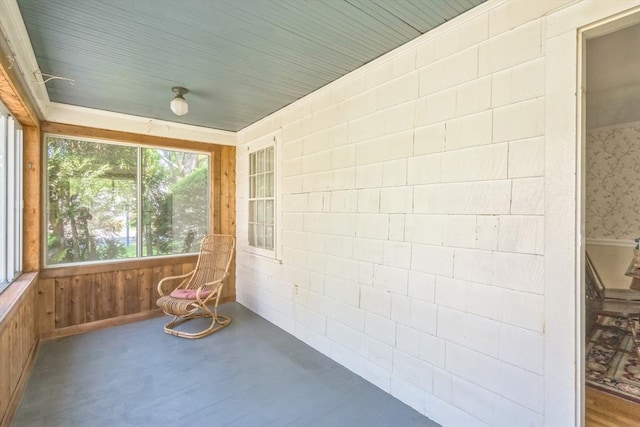 22 Sycamore Rd, Weymouth, MA 02190 - unfurnished sunroom with wooden walls and concrete flooring
