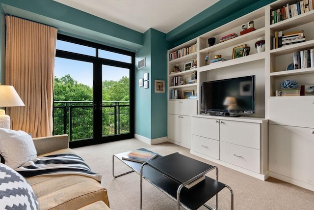 2400 Beacon St Unit 203, Boston, MA 02467 - living room with light carpet, baseboards, french doors, and built in features