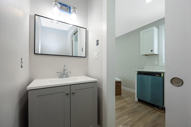 bathroom with hardwood / wood-style flooring and vanity