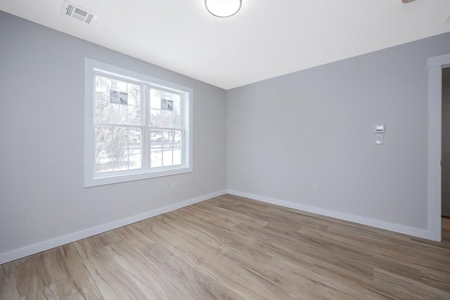 unfurnished room featuring light wood-type flooring