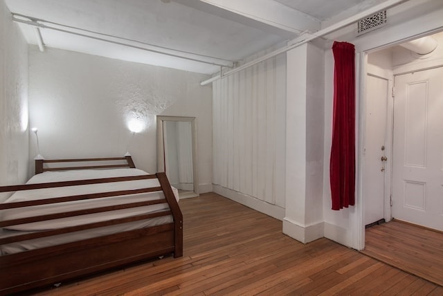 unfurnished bedroom featuring hardwood / wood-style floors