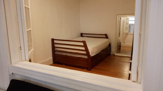 bedroom with wood-type flooring