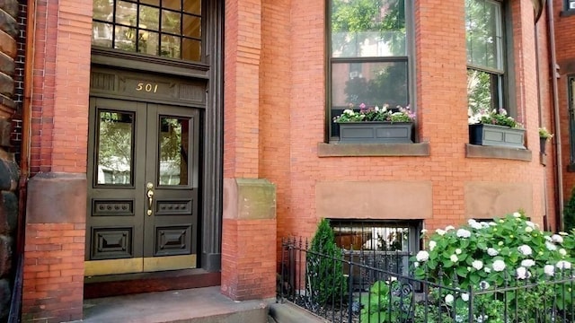 501 Beacon St Unit 1, Boston, MA 02215 - property entrance with french doors and brick siding
