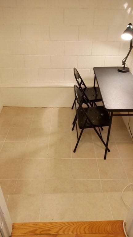 unfurnished dining area featuring tile patterned flooring