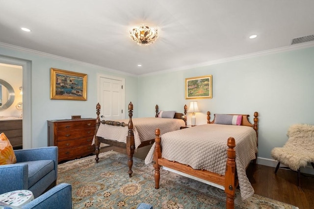 bedroom featuring crown molding, wood finished floors, recessed lighting, baseboards, and ensuite bath