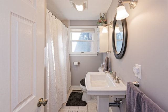 bathroom featuring tile patterned flooring and sink