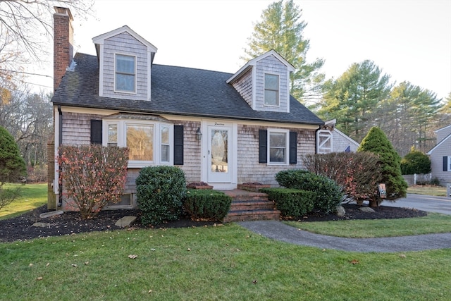 new england style home with a front yard