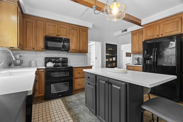 181 Lowell St, Andover, MA 01810 - kitchen featuring black appliances, a sink, decorative backsplash, a breakfast bar, and brown cabinetry