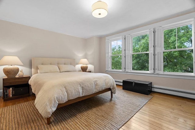 181 Lowell St, Andover, MA 01810 - bedroom featuring hardwood / wood-style floors, crown molding, and a baseboard heating unit