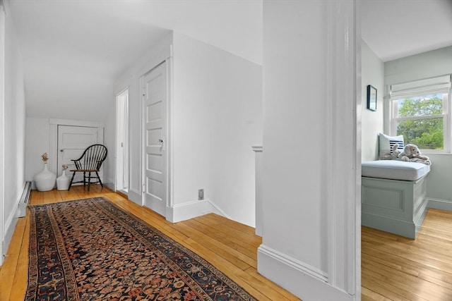 181 Lowell St, Andover, MA 01810 - hall featuring wood-type flooring, a baseboard radiator, and baseboards