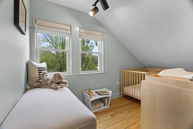 181 Lowell St, Andover, MA 01810 - bedroom featuring light wood-style flooring, lofted ceiling, and baseboards