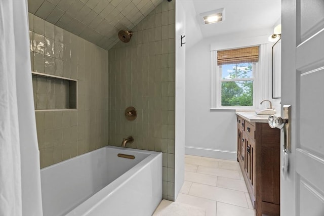 181 Lowell St, Andover, MA 01810 - bathroom with vaulted ceiling, vanity, tile patterned flooring, shower / bath combination, and baseboards
