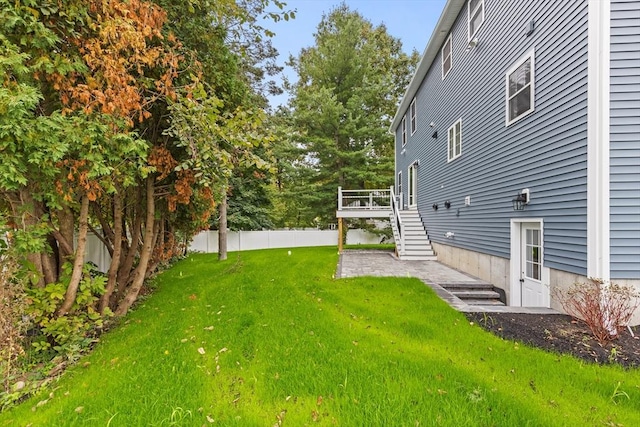 view of yard featuring a wooden deck