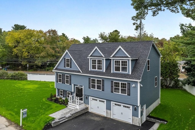 view of front facade featuring a garage and a front lawn