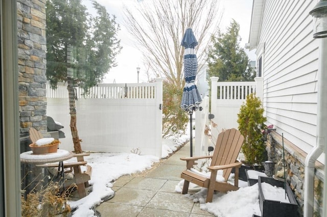 view of snow covered patio