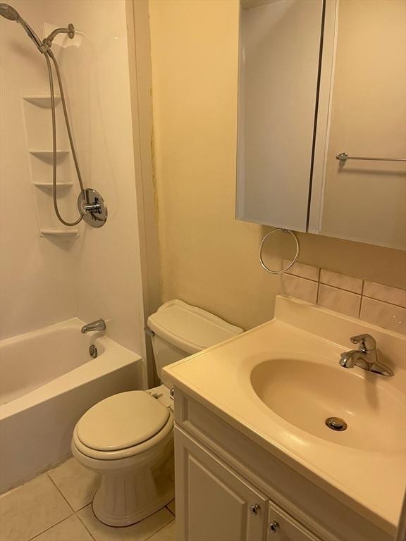 full bathroom featuring tile patterned flooring, shower / washtub combination, toilet, and vanity