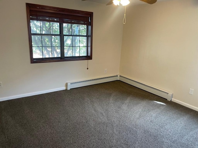 spare room featuring a baseboard heating unit, baseboards, a ceiling fan, and dark colored carpet