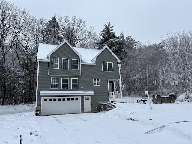 front of property with a garage