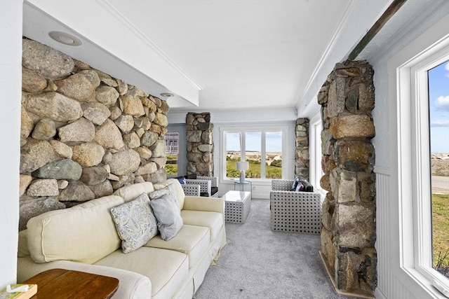 living room featuring crown molding and light carpet