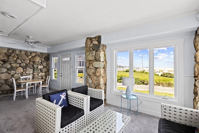 carpeted living room featuring ceiling fan