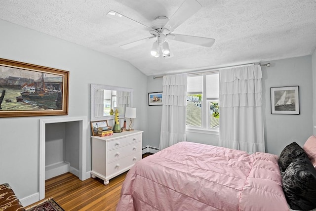 bedroom featuring ceiling fan, a baseboard radiator, a textured ceiling, vaulted ceiling, and light hardwood / wood-style flooring