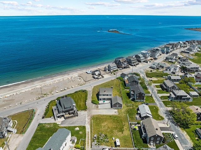 bird's eye view featuring a view of the beach and a water view