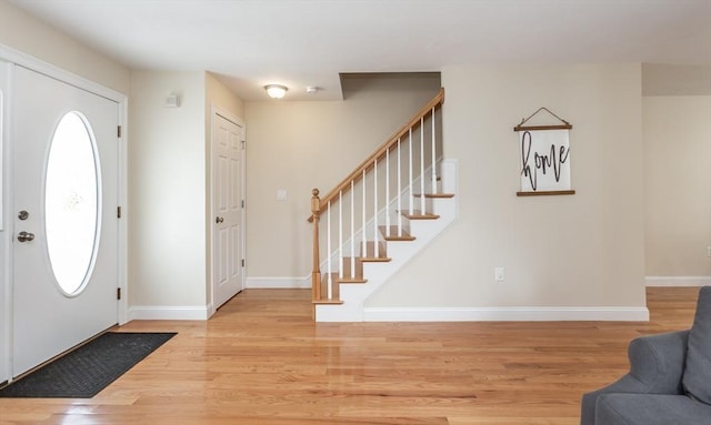 34 Bates St Unit 34, Abington, MA 02351 - entryway featuring wood finished floors, stairway, and baseboards