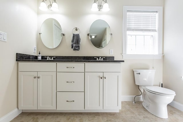 34 Bates St Unit 34, Abington, MA 02351 - full bathroom featuring baseboards, double vanity, toilet, and tile patterned floors