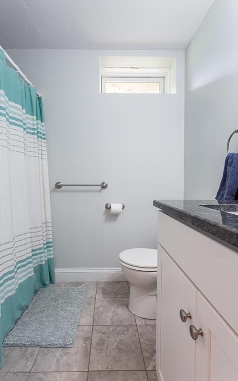 34 Bates St Unit 34, Abington, MA 02351 - bathroom with vanity, toilet, baseboards, and a shower with curtain