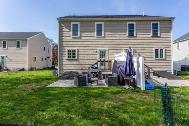 34 Bates St Unit 34, Abington, MA 02351 - back of house featuring a patio area, a yard, and central AC unit