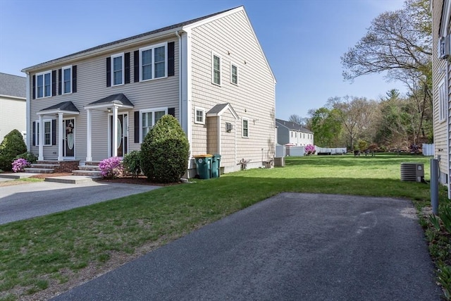 34 Bates St Unit 34, Abington, MA 02351 - view of front of home featuring cooling unit and a front yard
