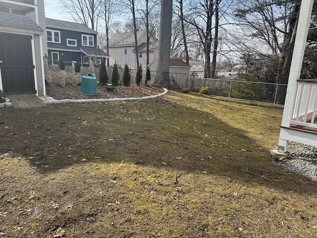 view of yard featuring a residential view and fence