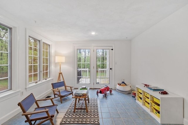 playroom featuring plenty of natural light, baseboards, tile patterned flooring, and recessed lighting