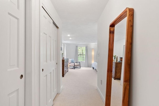 corridor featuring light carpet