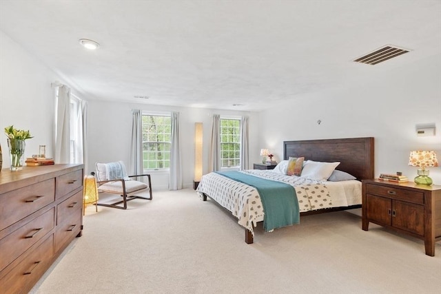 bedroom featuring light carpet
