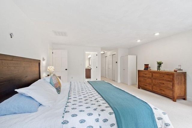 bedroom featuring carpet, recessed lighting, and connected bathroom