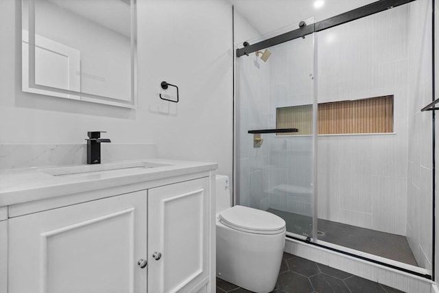 7 Denvir St Unit 2, Boston, MA 02124 - bathroom with toilet, tile patterned floors, a shower stall, and vanity