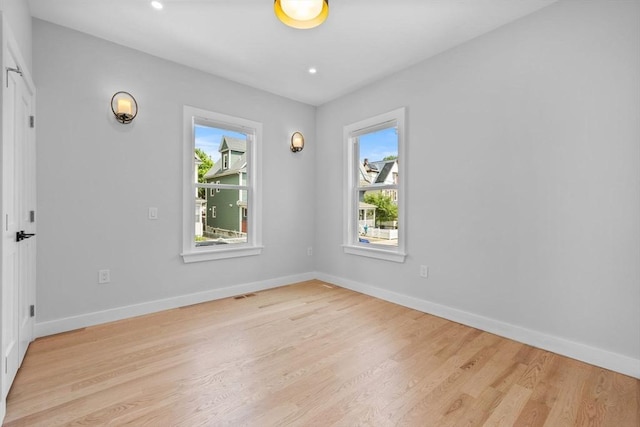 7 Denvir St Unit 2, Boston, MA 02124 - empty room with healthy amount of natural light, light wood-style floors, baseboards, and recessed lighting